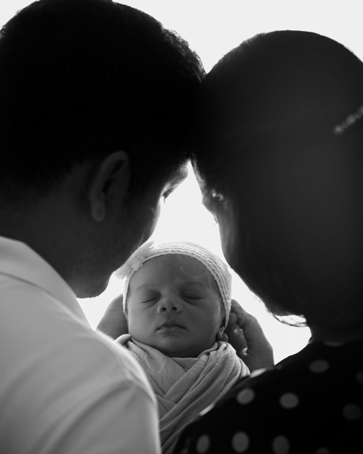 Newborn - parents holding baby